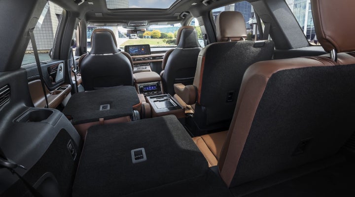 One side of the PowerFold® third-row seat and a second-row seat are folded forward in the 2026 Lincoln Aviator® SUV. | Deacon Jones Lincoln in Goldsboro NC