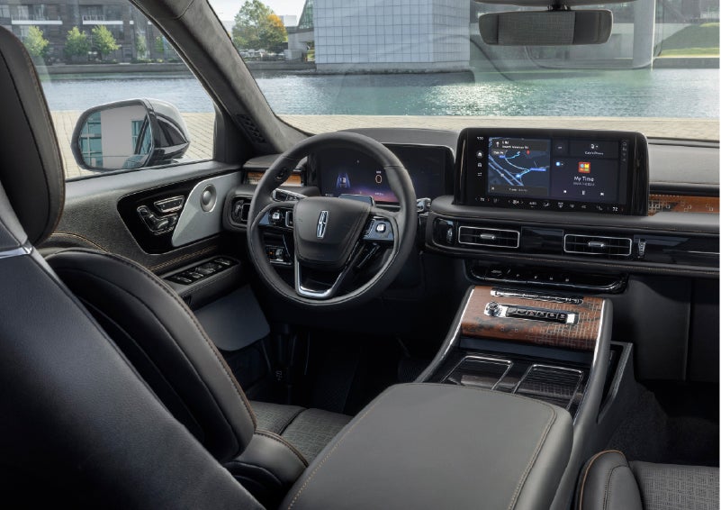 The interior of the 2026 Lincoln Aviator® SUV is shown parked with a view of a harbor through the windshield. | Deacon Jones Lincoln in Goldsboro NC