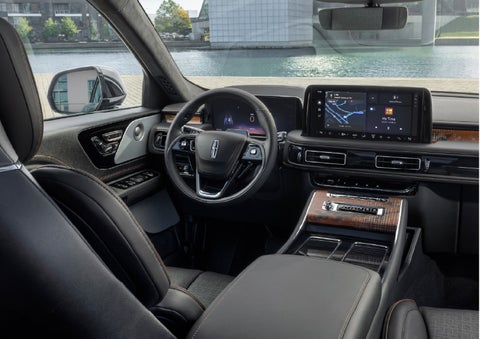 The interior of the 2026 Lincoln Aviator® SUV is shown parked with a view of a harbor through the windshield. | Deacon Jones Lincoln in Goldsboro NC