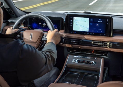 A person is driving a 2026 Lincoln Aviator® SUV as seen from inside the cabin. | Deacon Jones Lincoln in Goldsboro NC