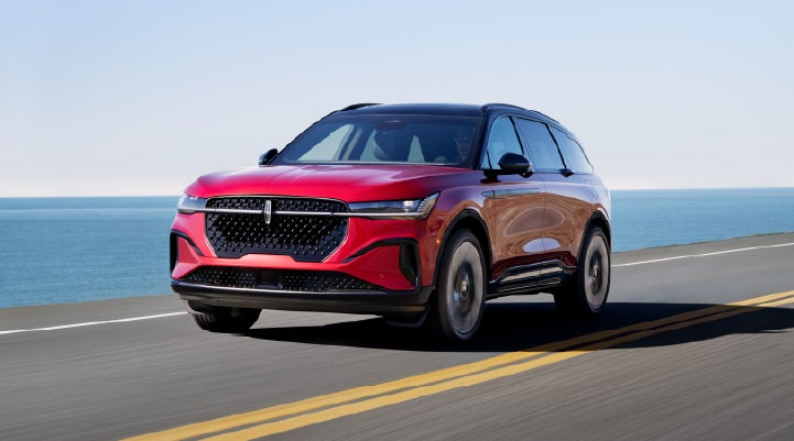 A 2026 Lincoln Nautilus® SUV is being driven on a seaside roadway. | Deacon Jones Lincoln in Goldsboro NC