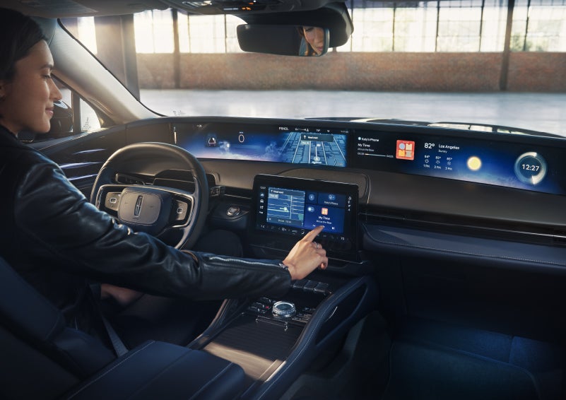 The driver of a 2026 Lincoln Nautilus® SUV interacts with the center touchscreen. | Deacon Jones Lincoln in Goldsboro NC