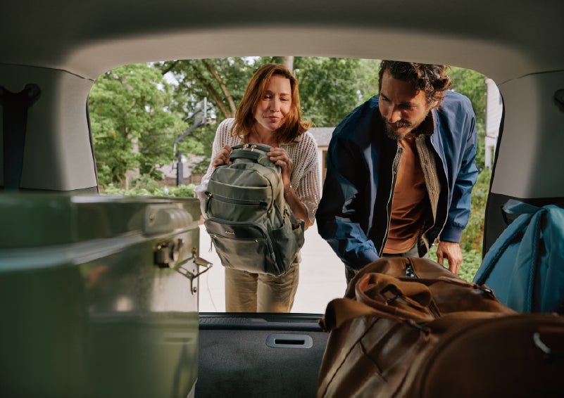 A couple loads luggage into the rear of a 2027 Lincoln Aviator® Black Label™ SUV..e 202 | Deacon Jones Lincoln in Goldsboro NC